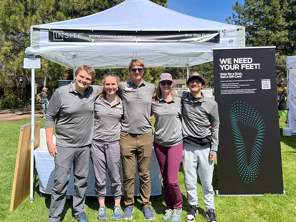 The INSITE biomechanics team and volunteers at the Pole, Pedal, Paddle Booth