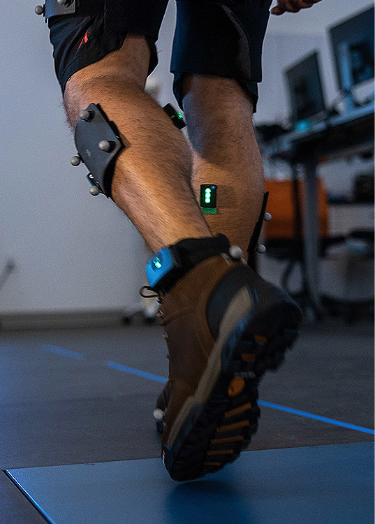 Test subject with sensors attached to legs and feet