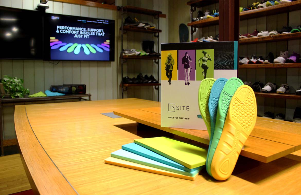 INSITE insoles and marketing material on a table