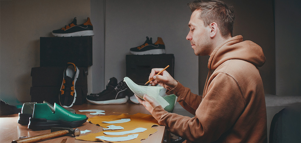 Man designing shoes