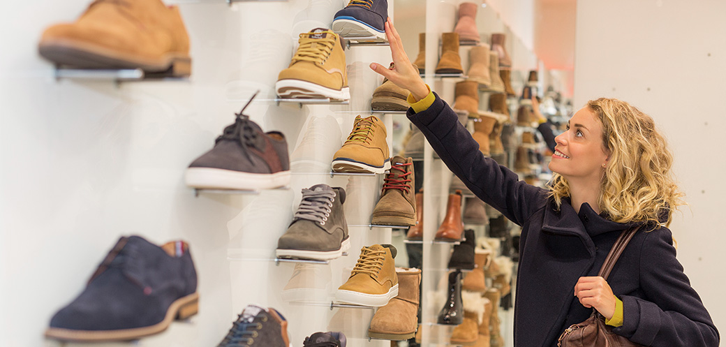 woman shopping for shoes she is less likely to return
