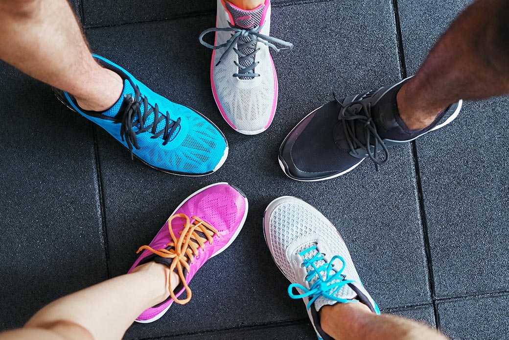 A bunch of different shoes on different people