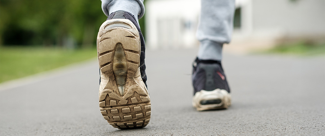 walking on old dirty sneakers